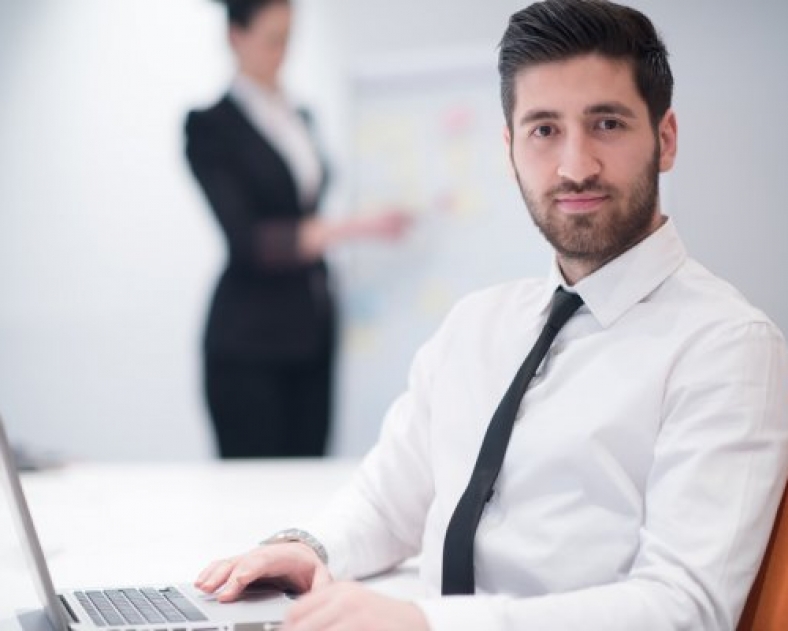 depositphotos_109876456-stock-photo-young-business-man-at-meeting