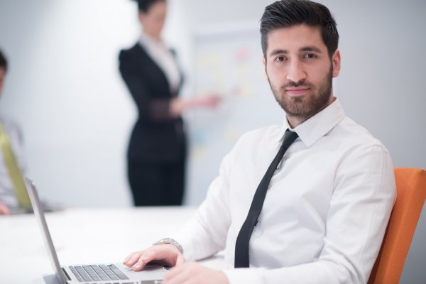 depositphotos_109876456-stock-photo-young-business-man-at-meeting